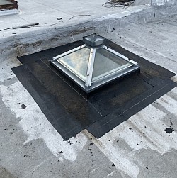 Skylight causing leak damages roof repair Chicago